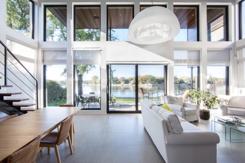 Ironclad Impact Windows & Doors — hurricane impact window installation, black matte frame close-up exterior