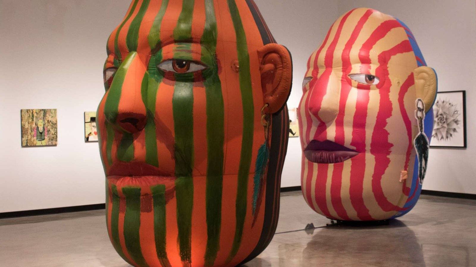Giant inflatable head sculptures at The Frank Art Gallery exhibition in Pembroke Pines, Florida
