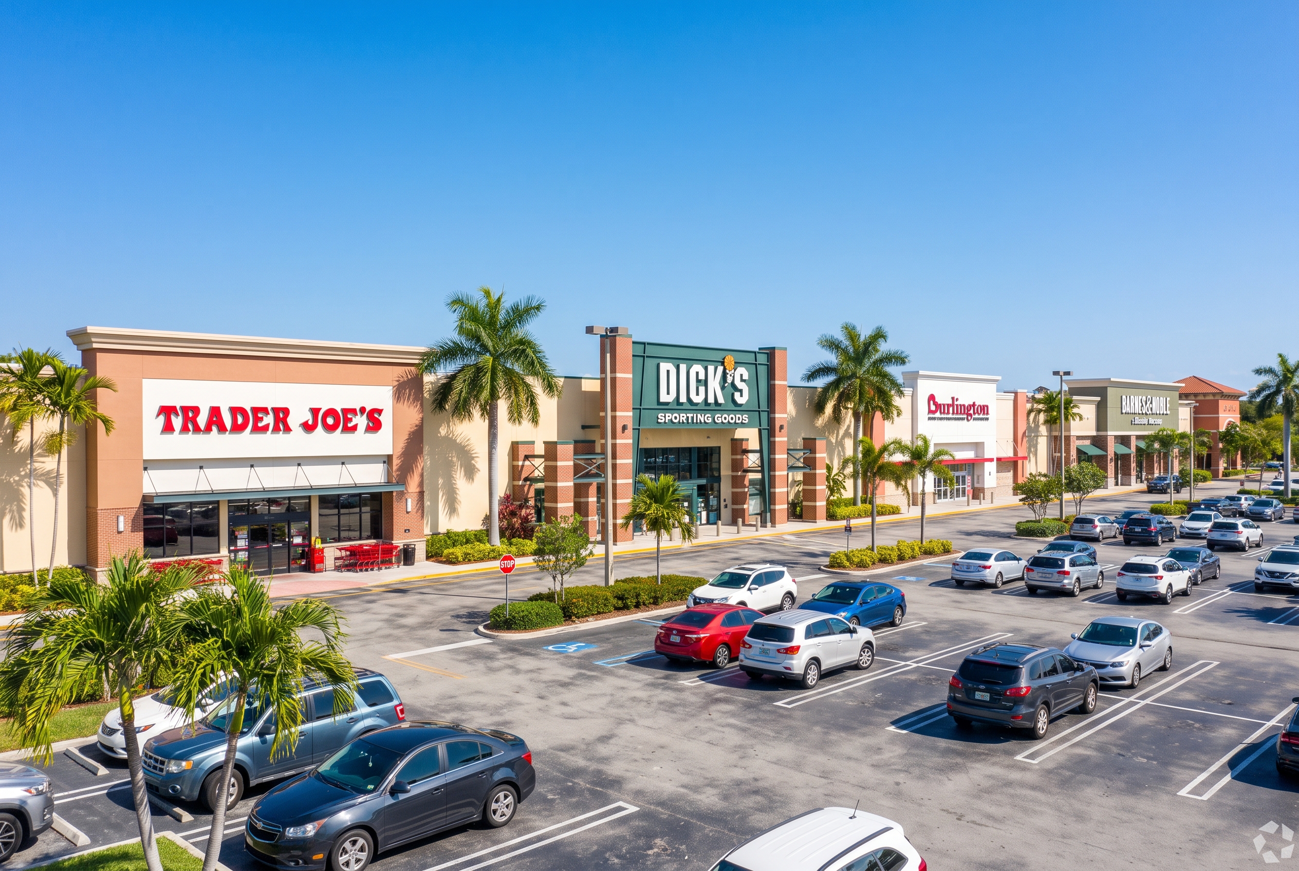 Pembroke Crossings shopping center entrance along Pines Boulevard in Pembroke Pines, Florida with palm trees and storefronts