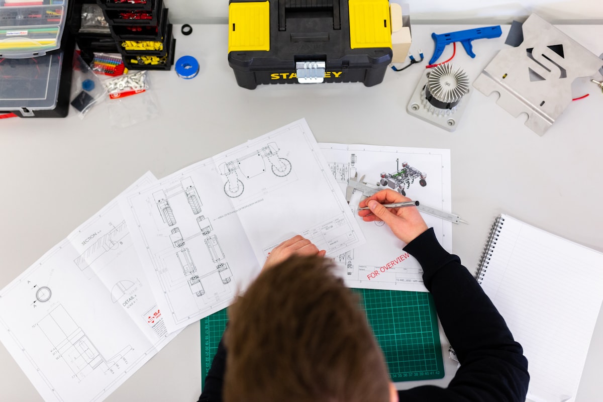 Children exploring robotics kits and hands-on engineering projects in a modern STEM learning lab